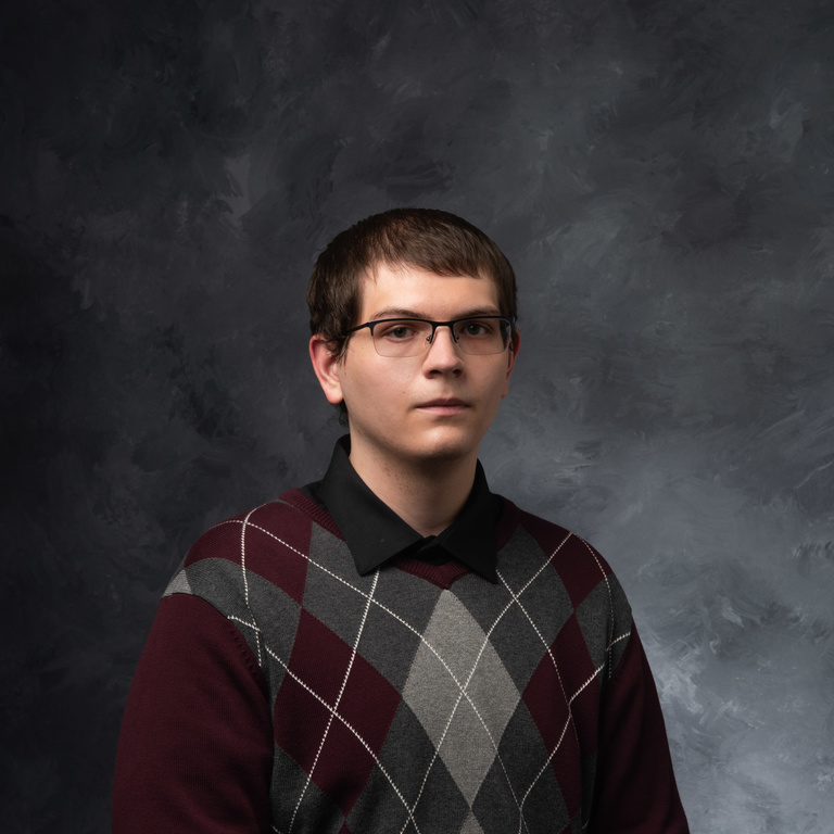 man in sweater and glasses